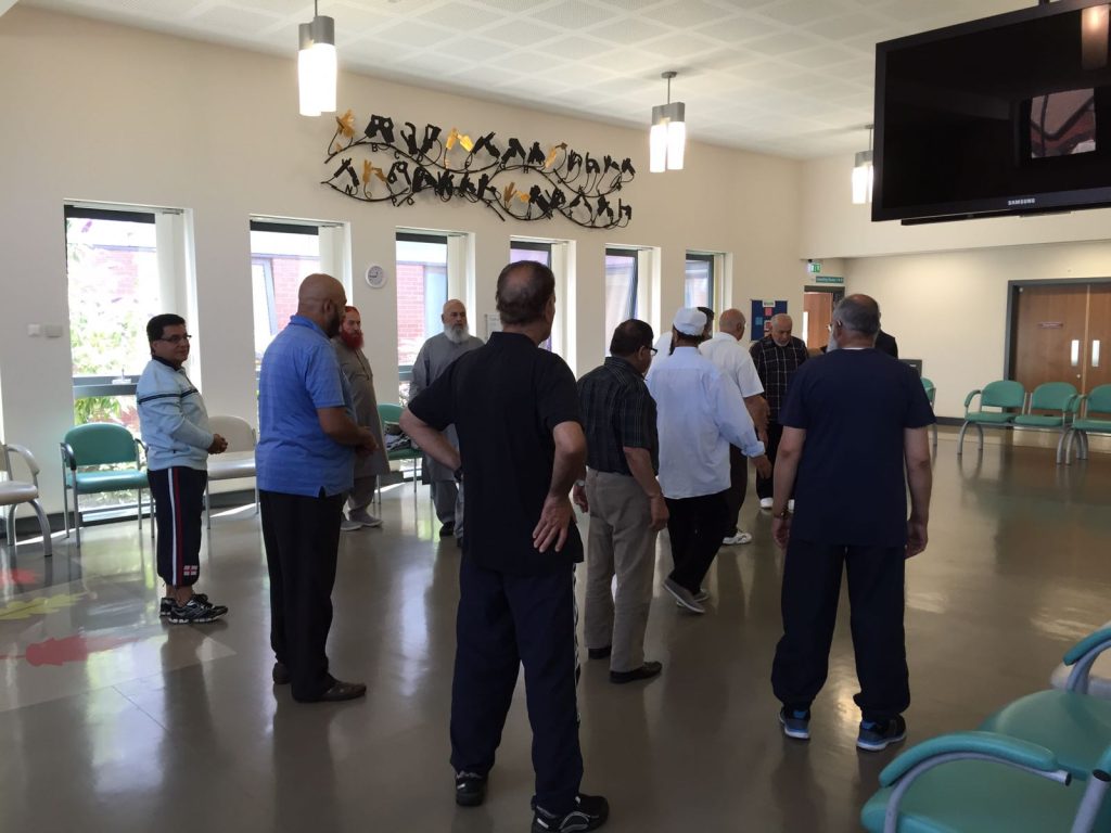 Photo of a group of men taking part in an exercise class