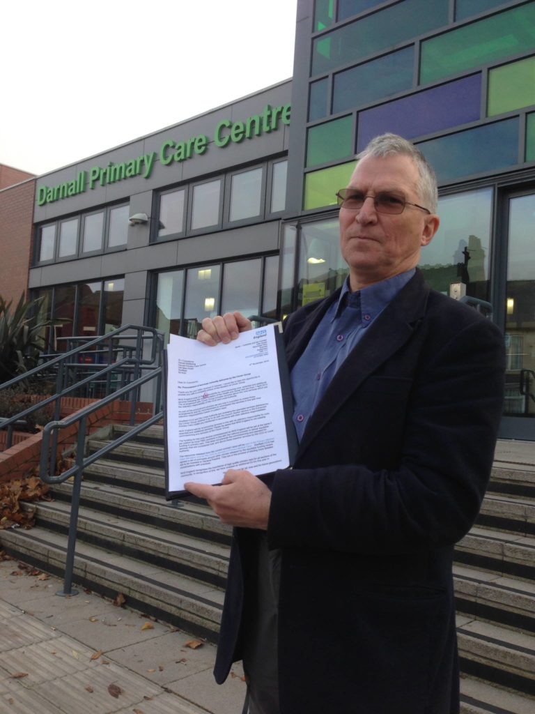Photo of Darnall Primary Care Centre with DWB founder Jack Czauderna standing outside