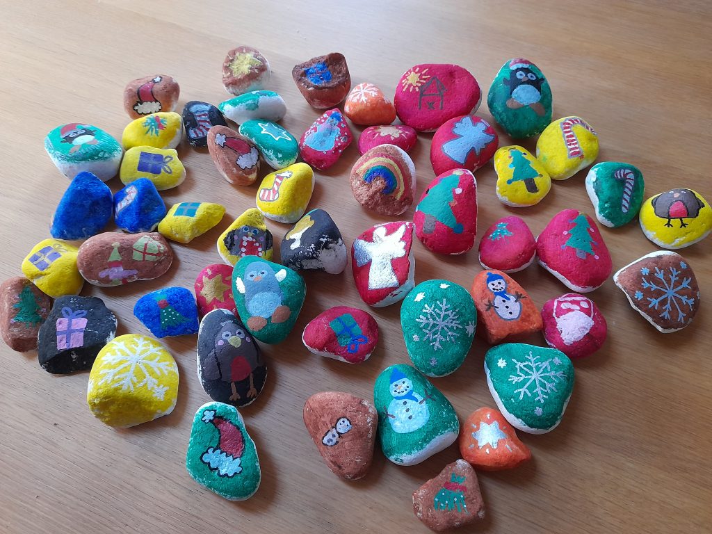 photo of pebbles painted with Christmas images