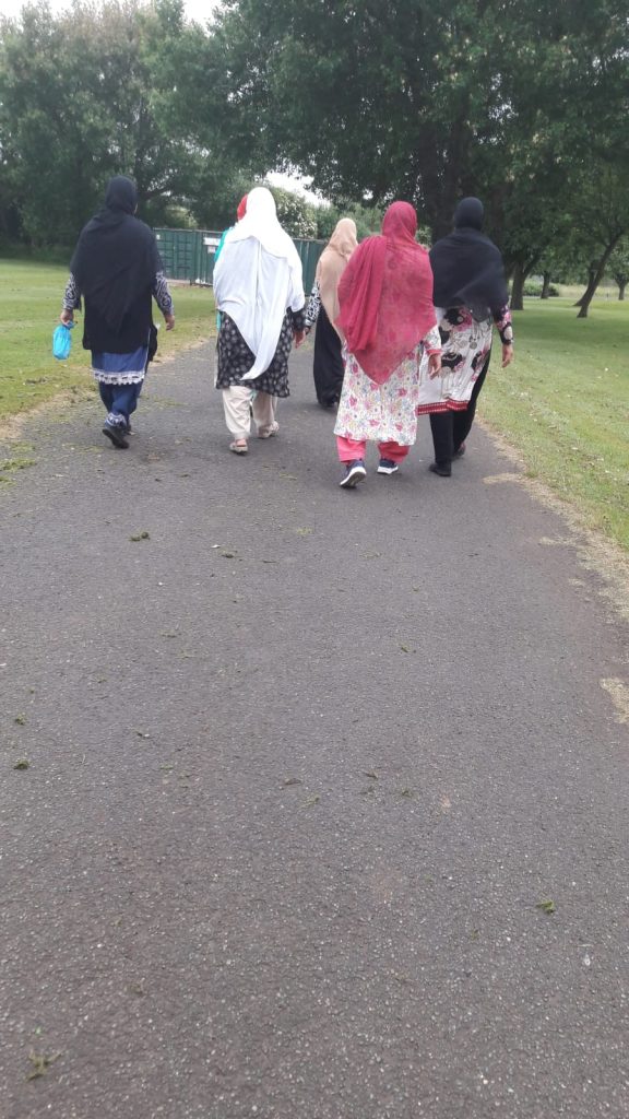 photo from behind of a group of women walking together