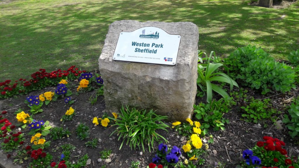Weston Park Sheffield sign on a rock in a flowerbed
