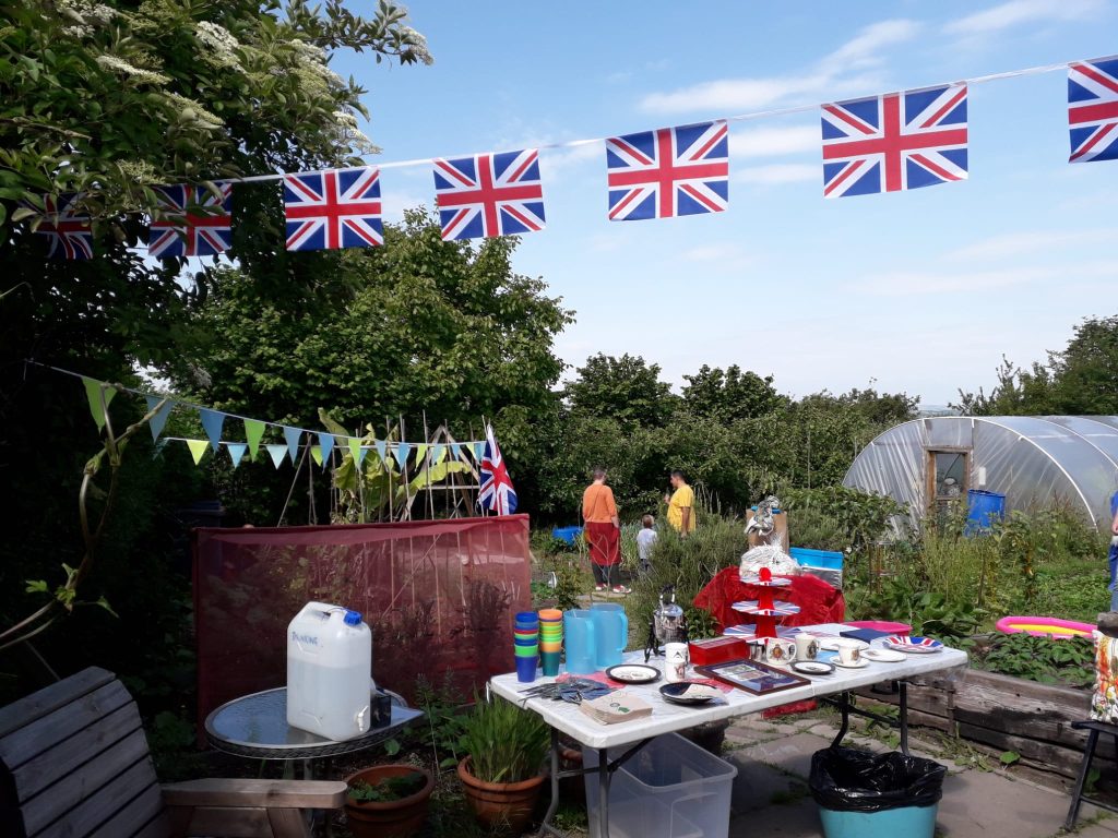 decorated table and Union Jack bunting at a community allotment