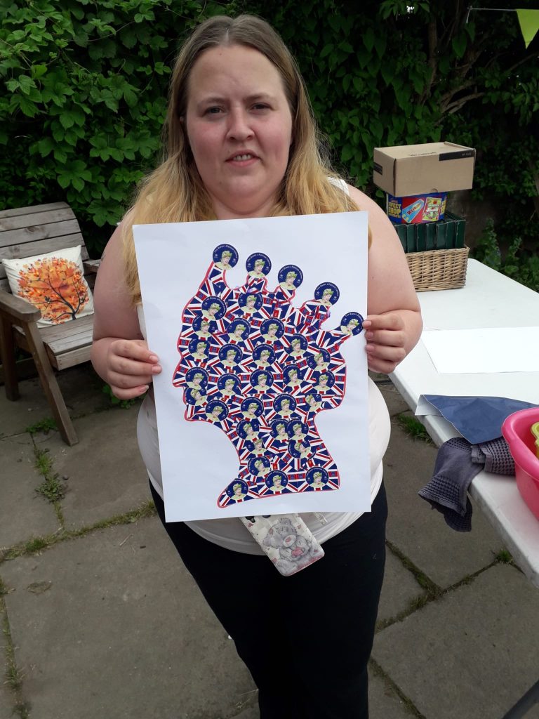 woman holding a collage of the head of Queen Elizabeth 2