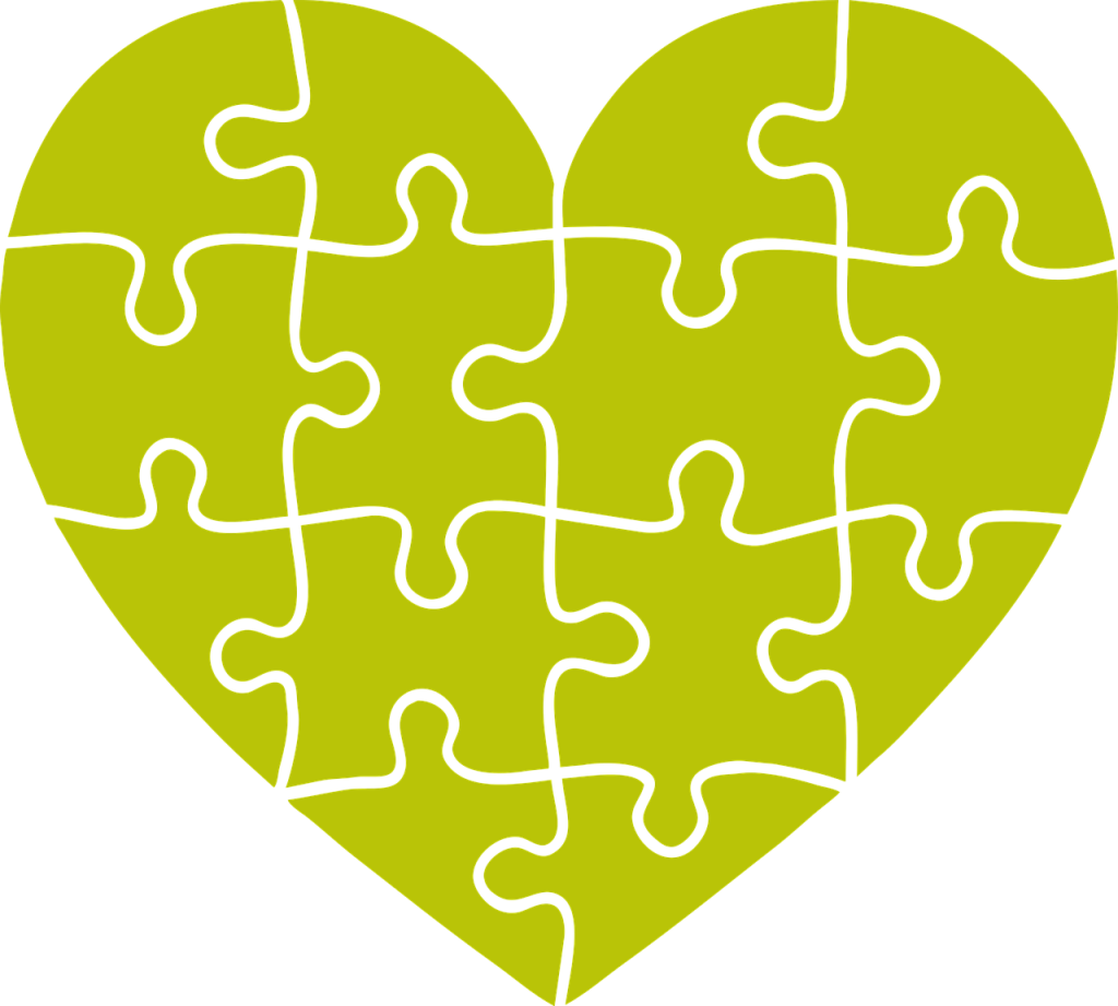 heart shape made of jigsaw puzzle pieces