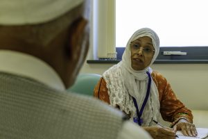 Noreen talking to a client